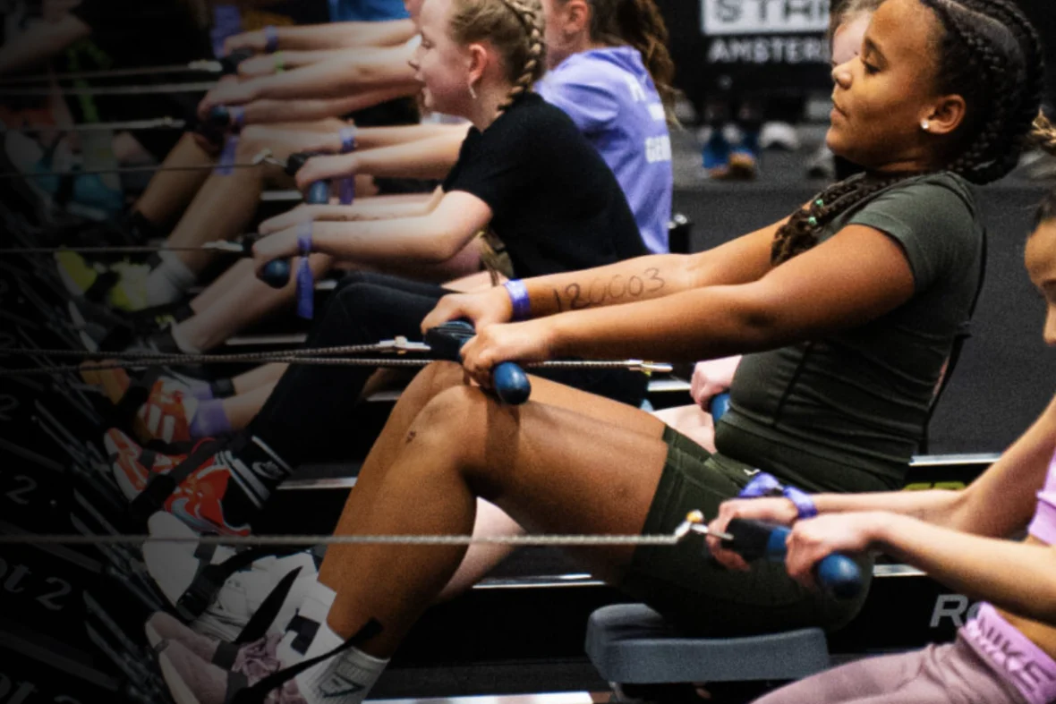 kids on rowing machines at a Hyrox race